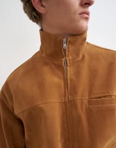 Model wearing Relaxed fit faux suede funnel neck bomber with double zip in tan