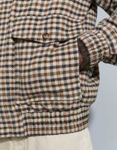 Model wearing Relaxed fit faux wool check harrington with double zip in neutral