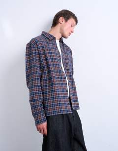 Model wearing Relaxed fit flannel check shirt in brown