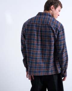 Model wearing Relaxed fit flannel check shirt in brown