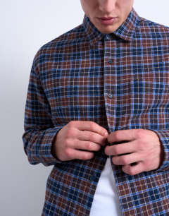 Model wearing Relaxed fit flannel check shirt in brown