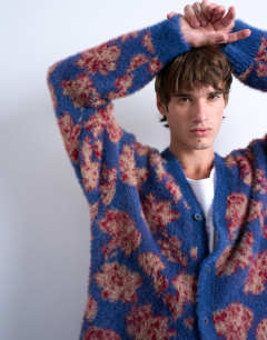 Model wearing Relaxed fit floral knit cardigan in purple