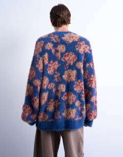 Model wearing Relaxed fit floral knit cardigan in purple