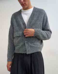 Model wearing Relaxed fit fluffy double pocket knitted cardigan in grey