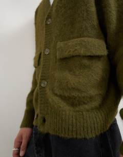 Model wearing Relaxed fit fluffy double pocket knitted cardigan in khaki