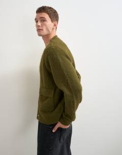 Model wearing Relaxed fit fluffy double pocket knitted cardigan in khaki