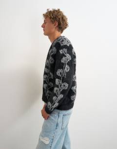 Model wearing Relaxed fit fluffy knit cardigan with floral design in black