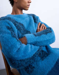 Model wearing Relaxed fit fluffy knitted jumper with stripe design in blue