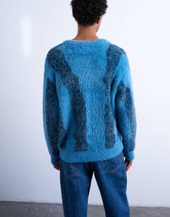 Model wearing Relaxed fit fluffy knitted jumper with stripe design in blue