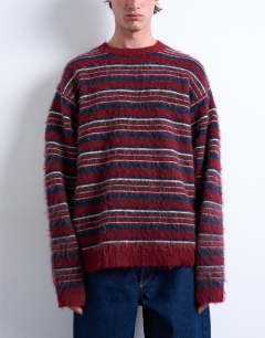 Model wearing Relaxed fit fluffy knitted stripe jumper in burgundy