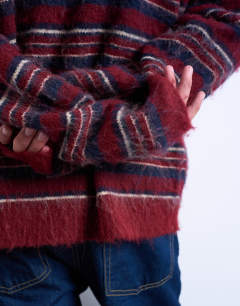 Model wearing Relaxed fit fluffy knitted stripe jumper in burgundy