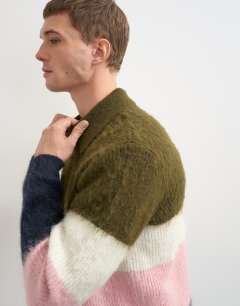 Model wearing Relaxed fit fluffy knitted zip through stripe polo in multi