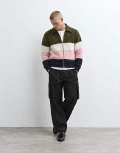 Model wearing Relaxed fit fluffy knitted zip through stripe polo in multi