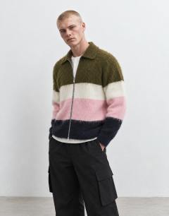 Model wearing Relaxed fit fluffy knitted zip through stripe polo in multi