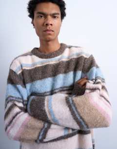 Model wearing Relaxed fit fluffy stripe knitted jumper in brown