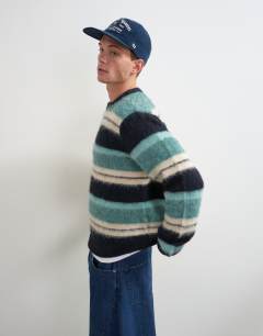 Model wearing Relaxed fit fluffy striped knitted jumper in teal