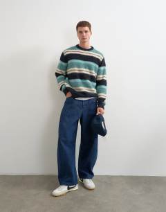 Model wearing Relaxed fit fluffy striped knitted jumper in teal