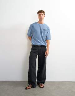 Model wearing Relaxed fit front and back social club print t-shirt in blue