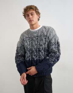 Model wearing Relaxed fit hand knitted cable jumper with ombre twist in navy