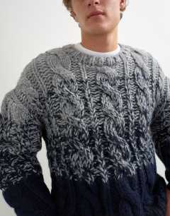 Model wearing Relaxed fit hand knitted cable jumper with ombre twist in navy
