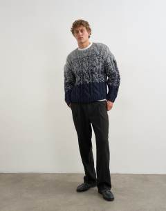 Model wearing Relaxed fit hand knitted cable jumper with ombre twist in navy