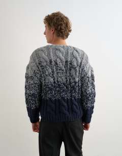 Model wearing Relaxed fit hand knitted cable jumper with ombre twist in navy