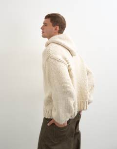 Model wearing Relaxed fit hand knitted heavyweight hoodie in ecru