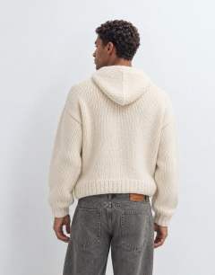 Model wearing Relaxed fit hand knitted heavyweight hoodie in ecru