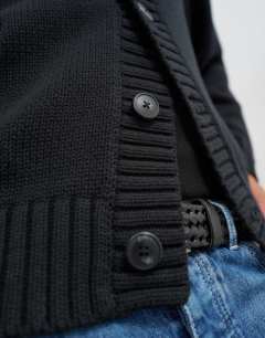 Model wearing Relaxed fit heavyweight funnel neck jumper in black