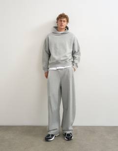 Model wearing Relaxed fit heavyweight hoodie in grey marl