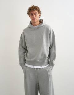 Model wearing Relaxed fit heavyweight hoodie in grey marl