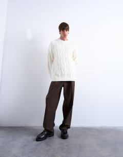 Model wearing Relaxed fit heavyweight knitted jumper with cable in cream