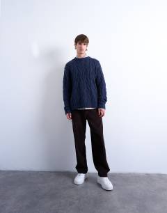 Model wearing Relaxed fit heavyweight knitted jumper with cable in navy