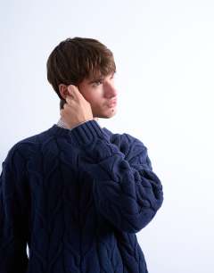 Model wearing Relaxed fit heavyweight knitted jumper with cable in navy