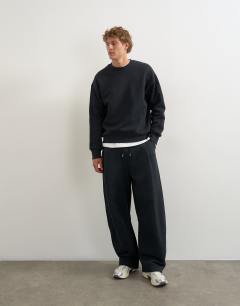 Model wearing Relaxed fit heavyweight sweatshirt in black