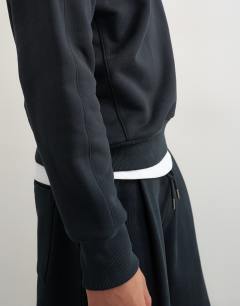 Model wearing Relaxed fit heavyweight sweatshirt in black
