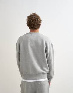 Model wearing Relaxed fit heavyweight sweatshirt in grey marl