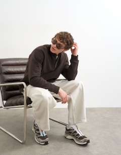 Model wearing Relaxed fit henley sweatshirt in brown