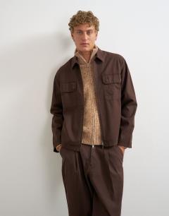 Model wearing Relaxed fit herringbone overshirt in brown
