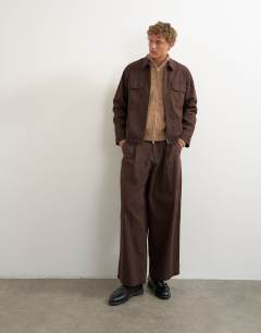 Model wearing Relaxed fit herringbone overshirt in brown