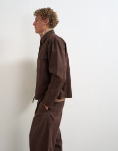 Model wearing Relaxed fit herringbone overshirt in brown