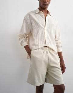 Model wearing Relaxed fit jersey short in washed stone