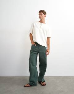 Model wearing Relaxed fit jersey twill baseball henley shirt in ecru