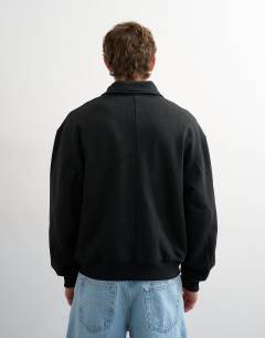 Model wearing Relaxed fit jersey utility shacket with funnel in black