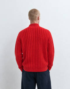 Model wearing Relaxed fit knitted 1/4 zip funnel neck knitted jumper in red