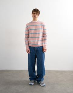 Model wearing Relaxed fit knitted brushed stripe jumper in pink