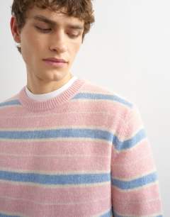 Model wearing Relaxed fit knitted brushed stripe jumper in pink