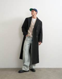 Model wearing Relaxed fit knitted cable cardigan in oatmeal
