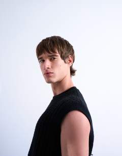 Model wearing Relaxed fit knitted cable tank in black