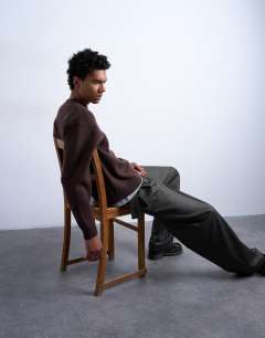 Model wearing Relaxed fit knitted crew neck jumper in brown